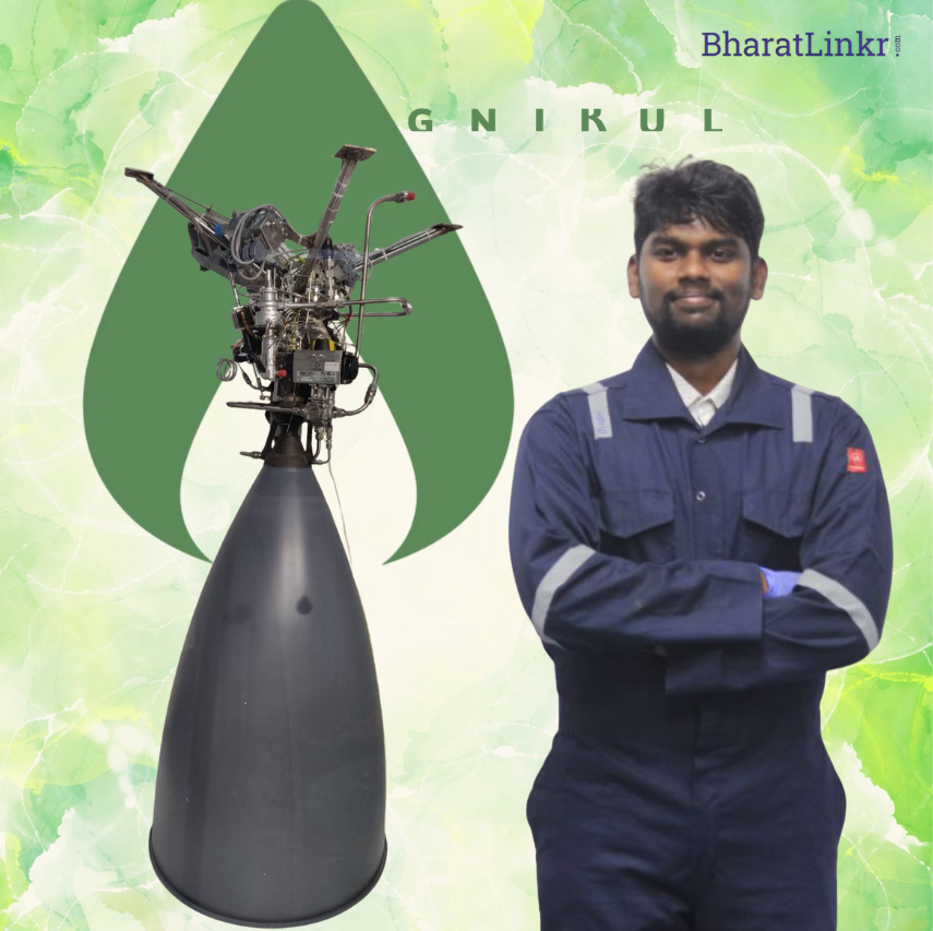 A man in a navy-blue work suit stands with arms crossed beside a large rocket engine, with the Agnikul logo in the background.
